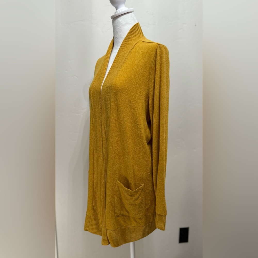 Super soft golden color cardigan. With Pockets.